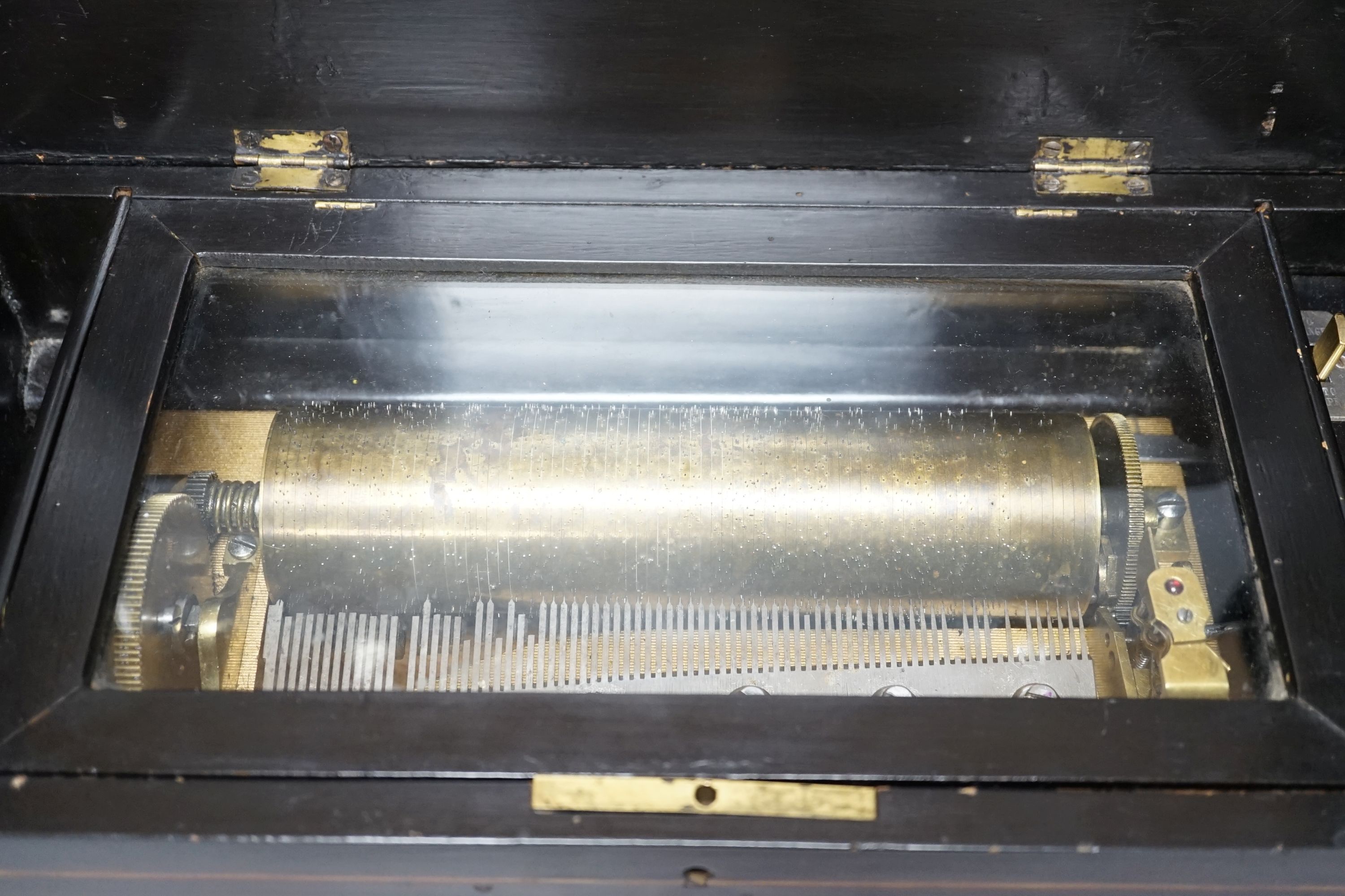 A 19th Century Swiss cylinder music box, in inlaid case, 15 x 43cm